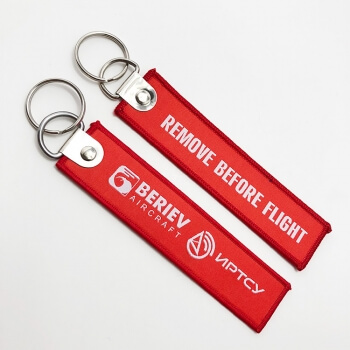 Custom remove before flight logo woven keychain