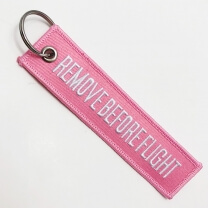 Cheap custom made embroidered remove before flight keychain