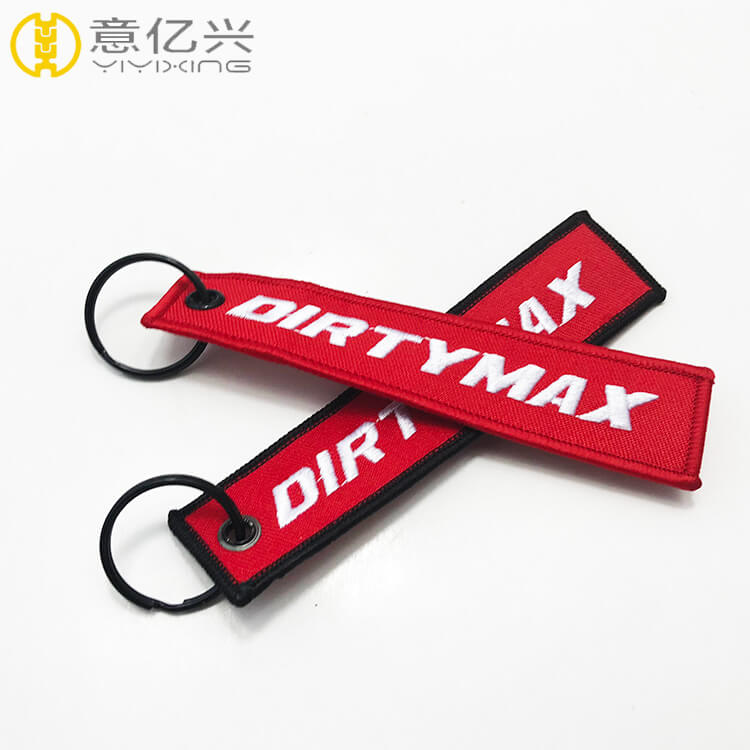 China wholesale beautiful fabric keychain custom embroidered key tags