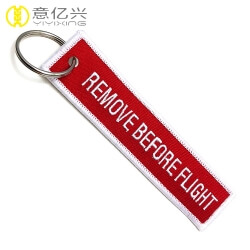 High quality embroidery custom logo remove before flight tags keychain