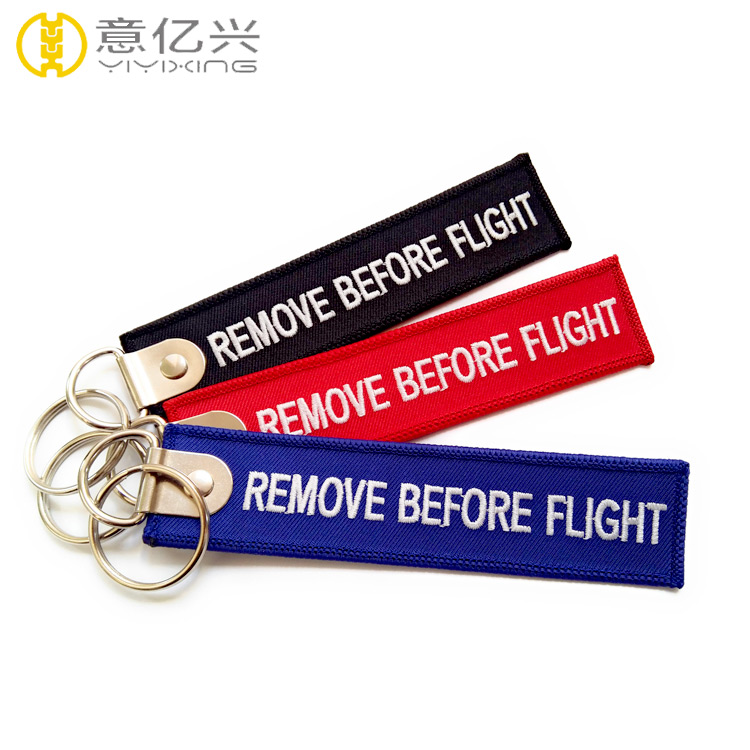 personalized remove before flight keychain