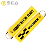Popular style custom yellow embroidered remove before flight keyrings