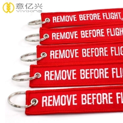 Wholesale cheap cloth remove before flight streamer keychain