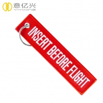 Custom embroidery logo label red insert before flight keychain