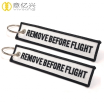OEM stylish printing white tape remove before flight keychain design