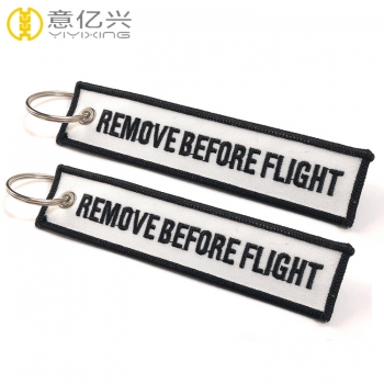 OEM stylish printing white tape remove before flight keychain design