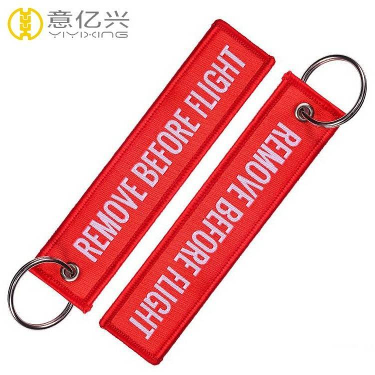 personalized remove before flight keychain