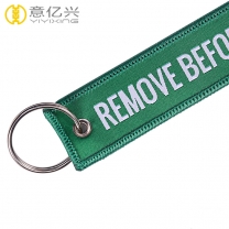 High quality free samples custom woven take off before flight keychain