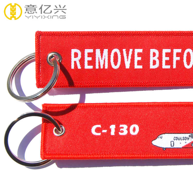 woven remove before flight key chain