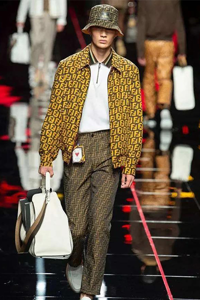 Model wearing a keychain on the catwalk